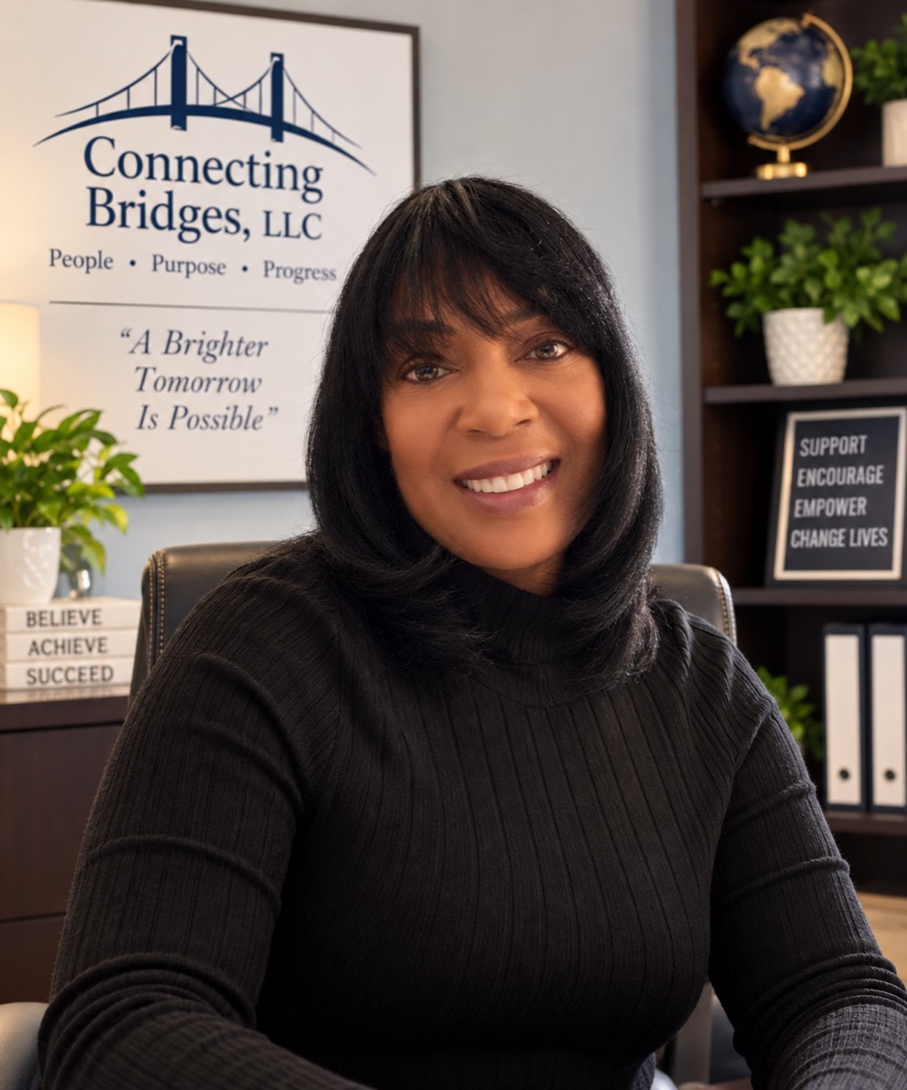 Shantina Hinton, Founder and Executive Director of Connecting Bridges, seated in her office